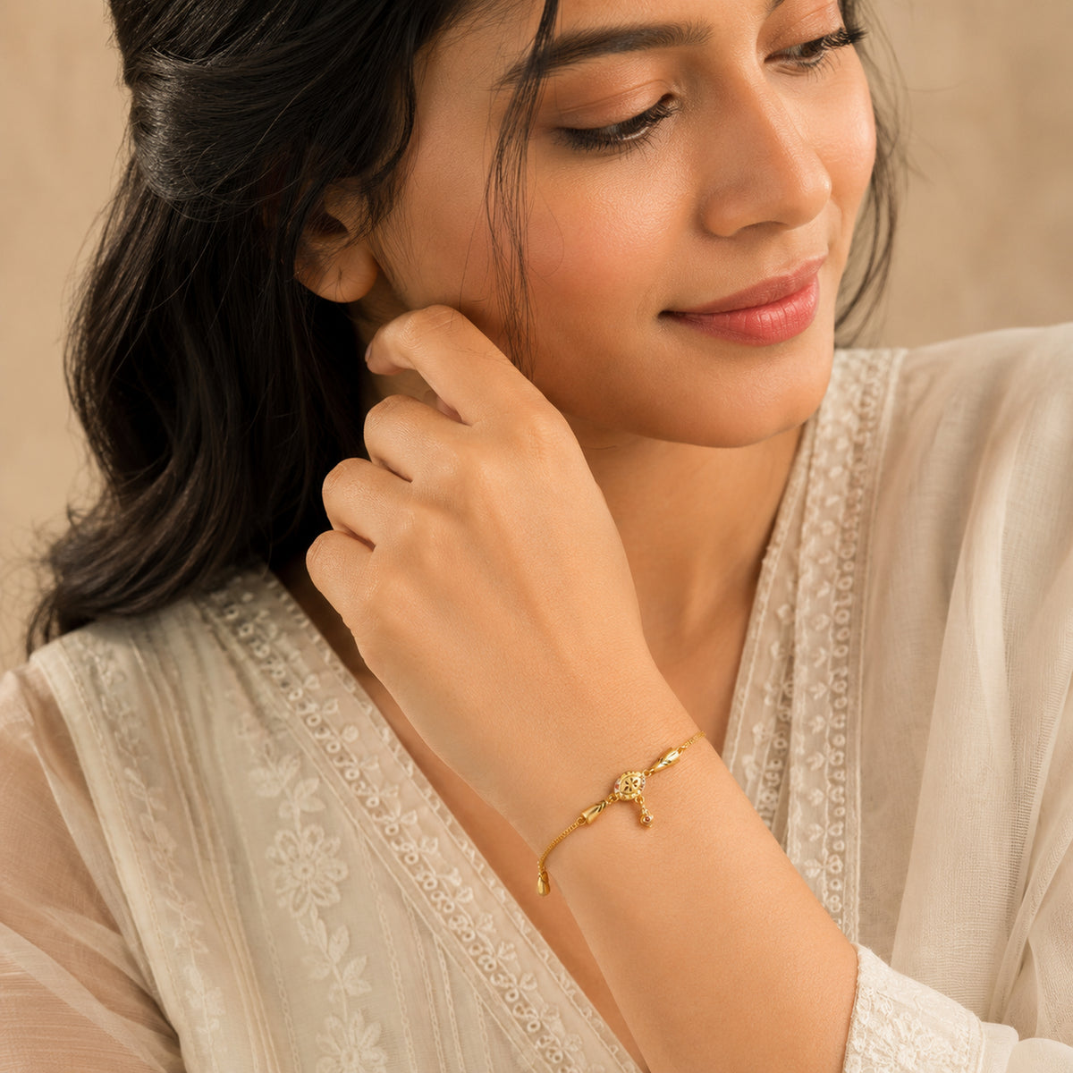 Floral charm bracelet worn with a cream embroidered outfit