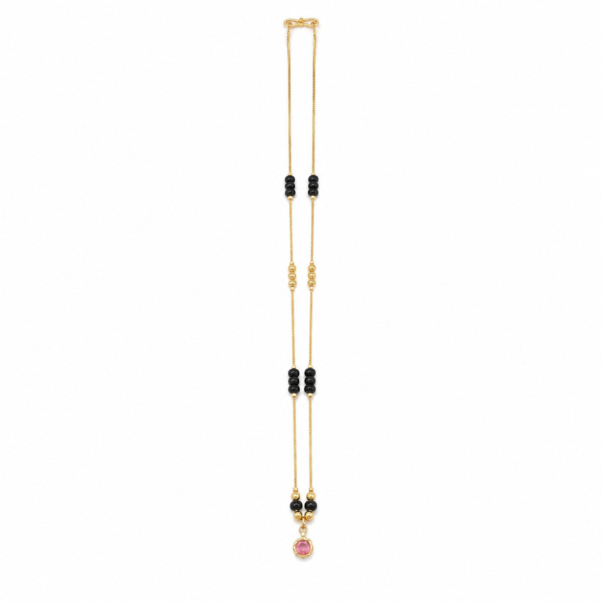 Gold-tone mangalsutra with spaced black bead clusters and a round pink pendant on white