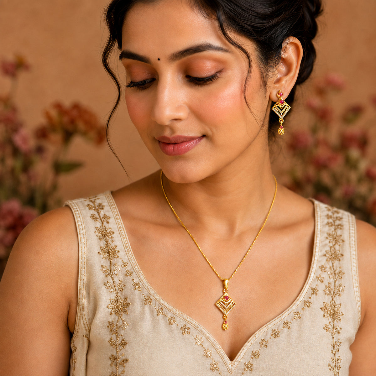 Chevron pendant necklace and matching earrings worn with a cream outfit