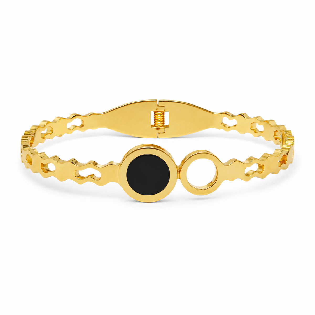 Gold-tone stainless steel hinged bangle with a black disc and open circle on white