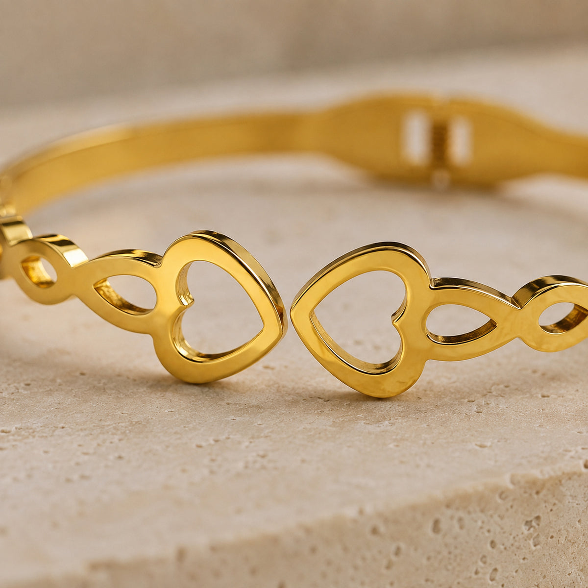 Close-up of the two open hearts and polished openwork band