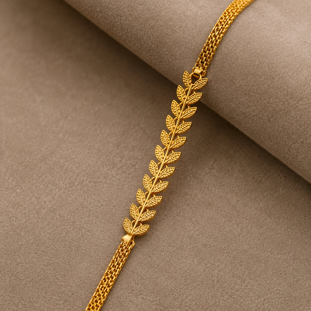 Close-up of the textured leaf links and woven-style chain