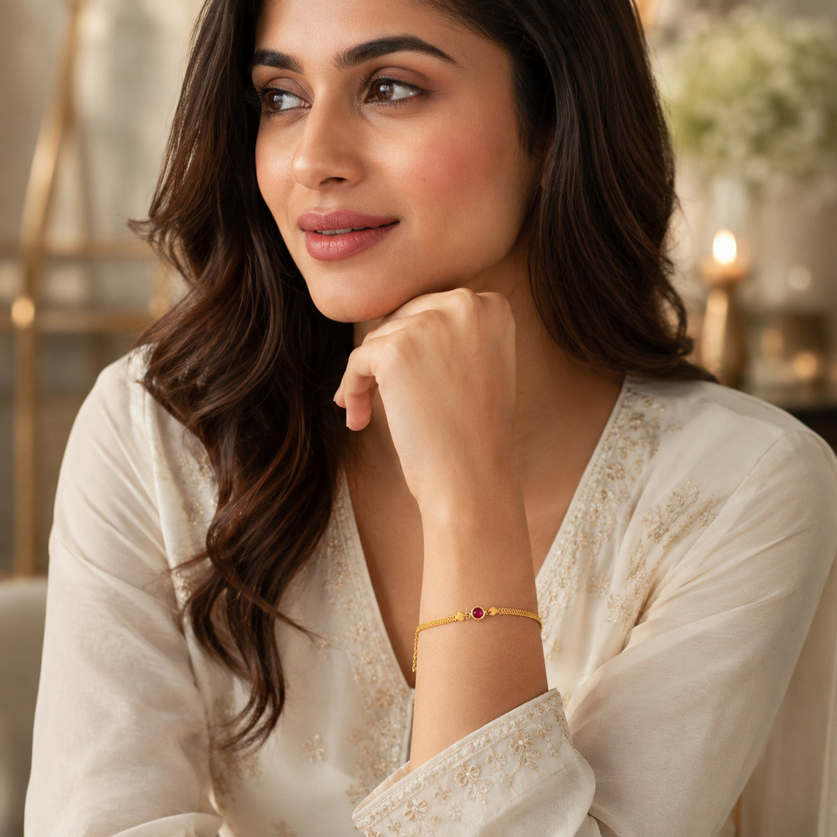 Red stone brass bracelet worn with a cream embroidered outfit