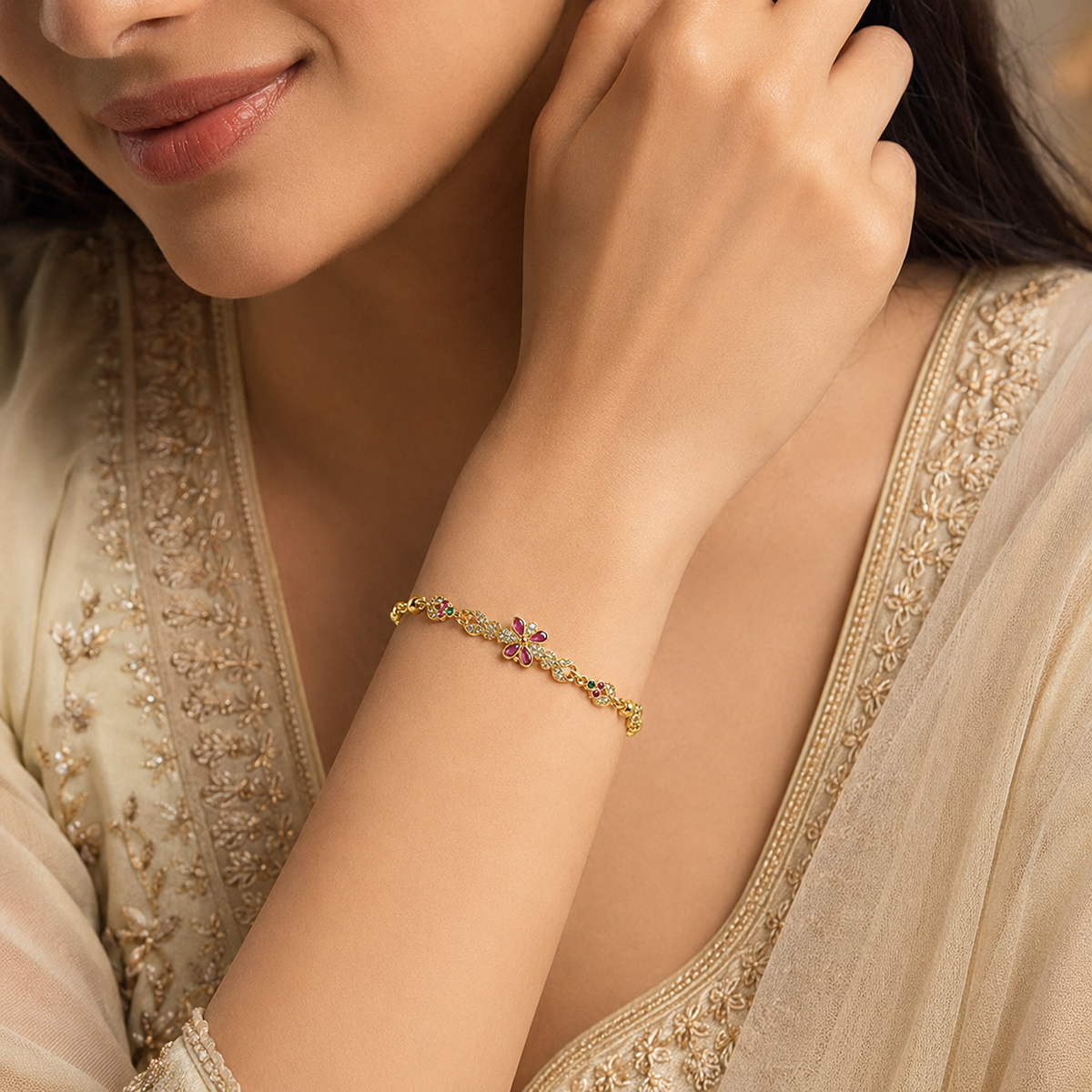 Pink and green floral bracelet worn with a cream outfit