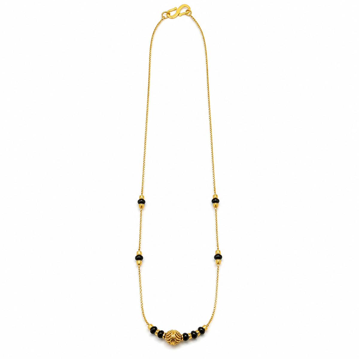 Gold-tone mangalsutra with spaced black beads and a textured centre bead on white