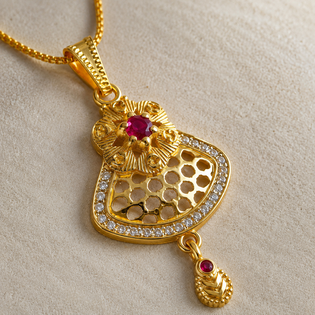 Close-up of the magenta centre, pierced lattice and clear stone border