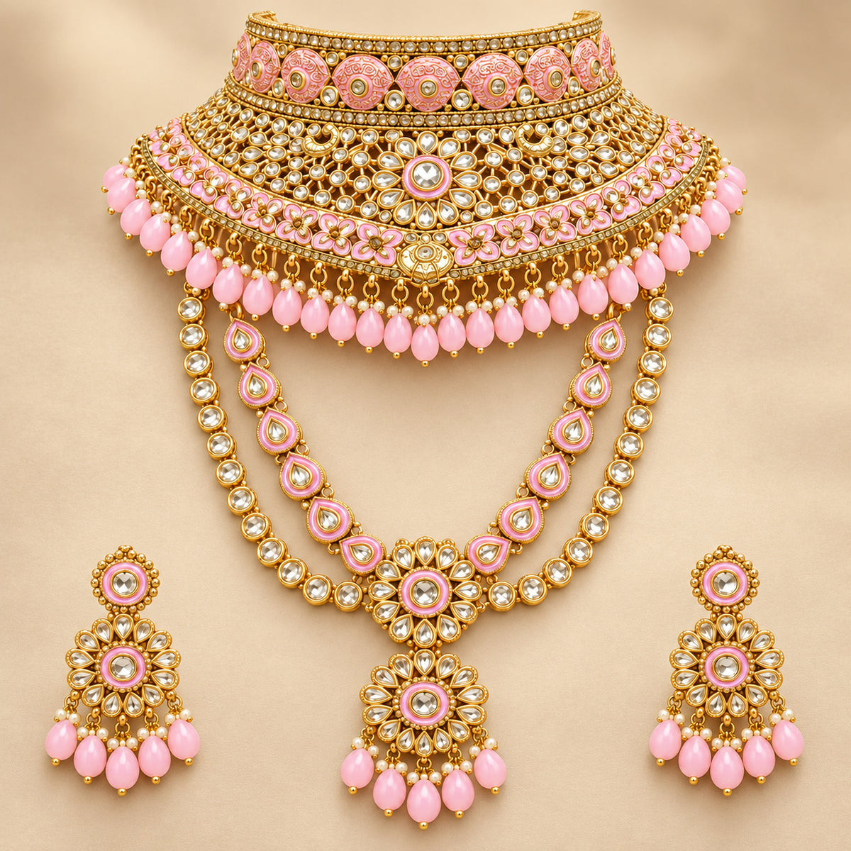 Pastel pink floral choker and layered stone-link haar on a beige bust with matching drop earrings
