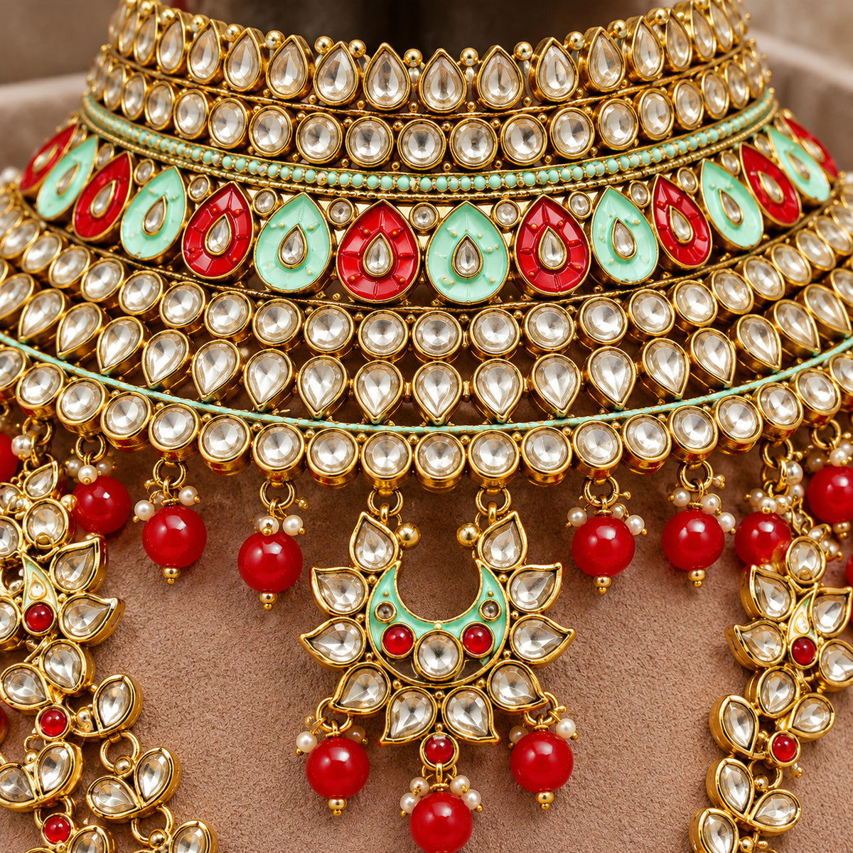 Close-up of alternating red and mint green teardrops, clear stones and red bead drops