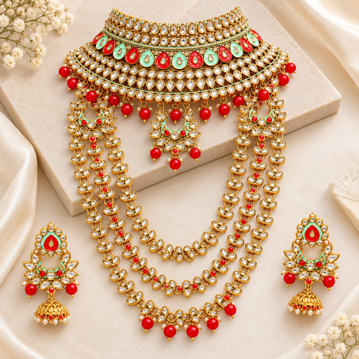 Alternate display of the red and mint green choker, layered long haar and jhumkas