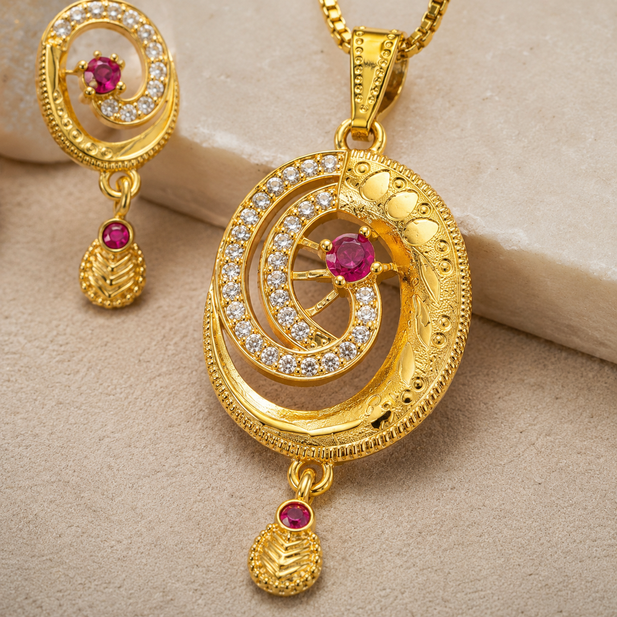 Close-up of the pink centre stone, clear spiral accents and textured pendant