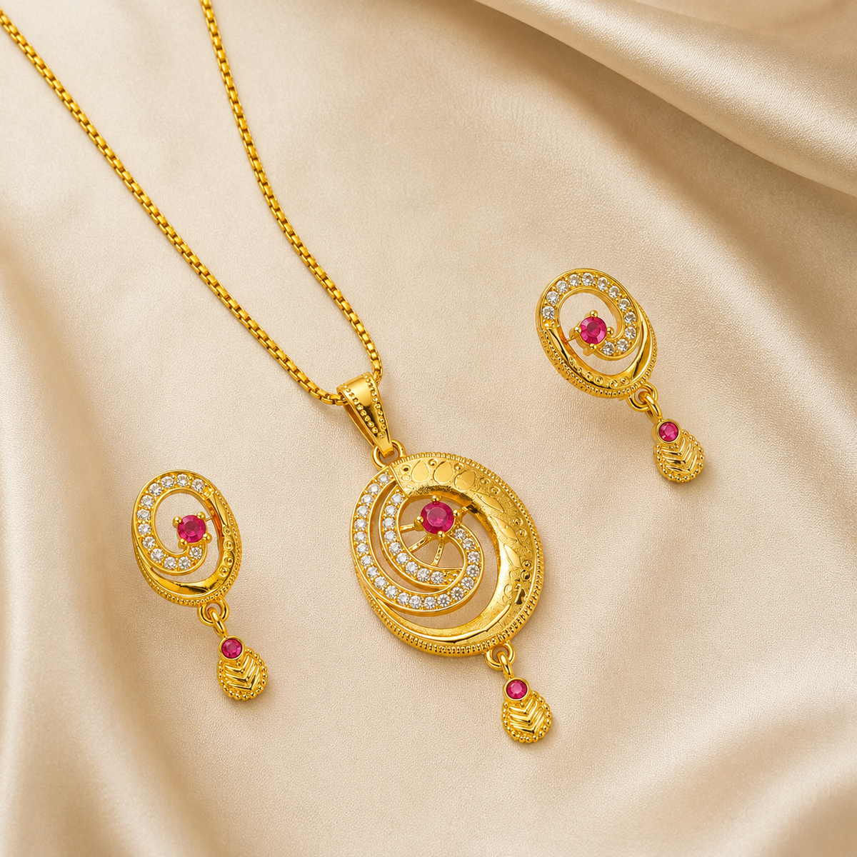 Pink and clear swirl pendant with matching earrings on folded cream fabric
