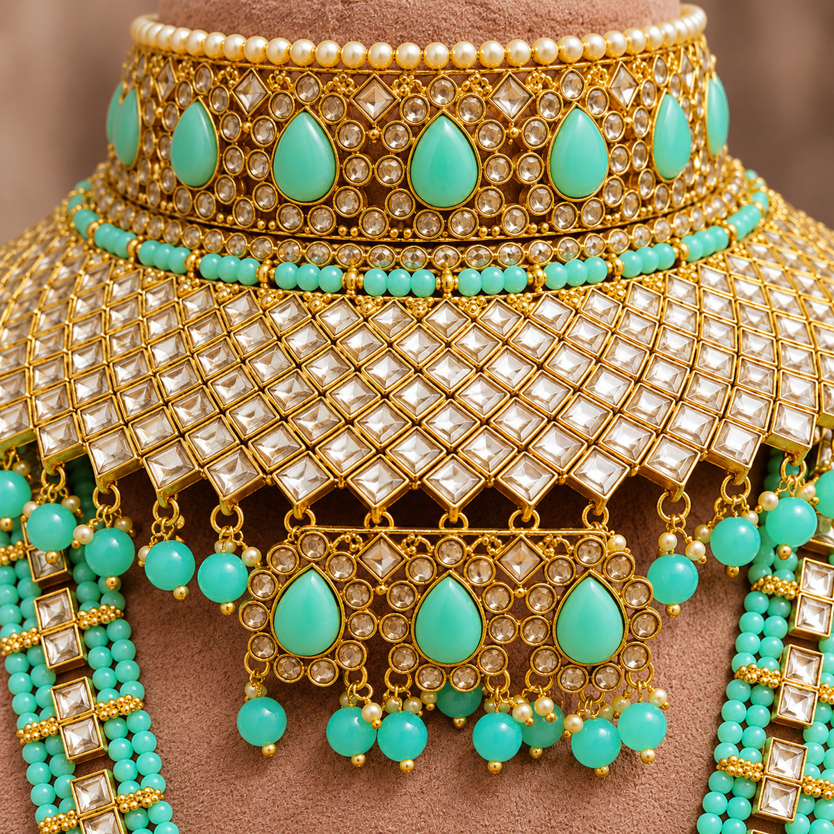 Close-up of turquoise teardrops, clear lattice stonework and coloured bead drops