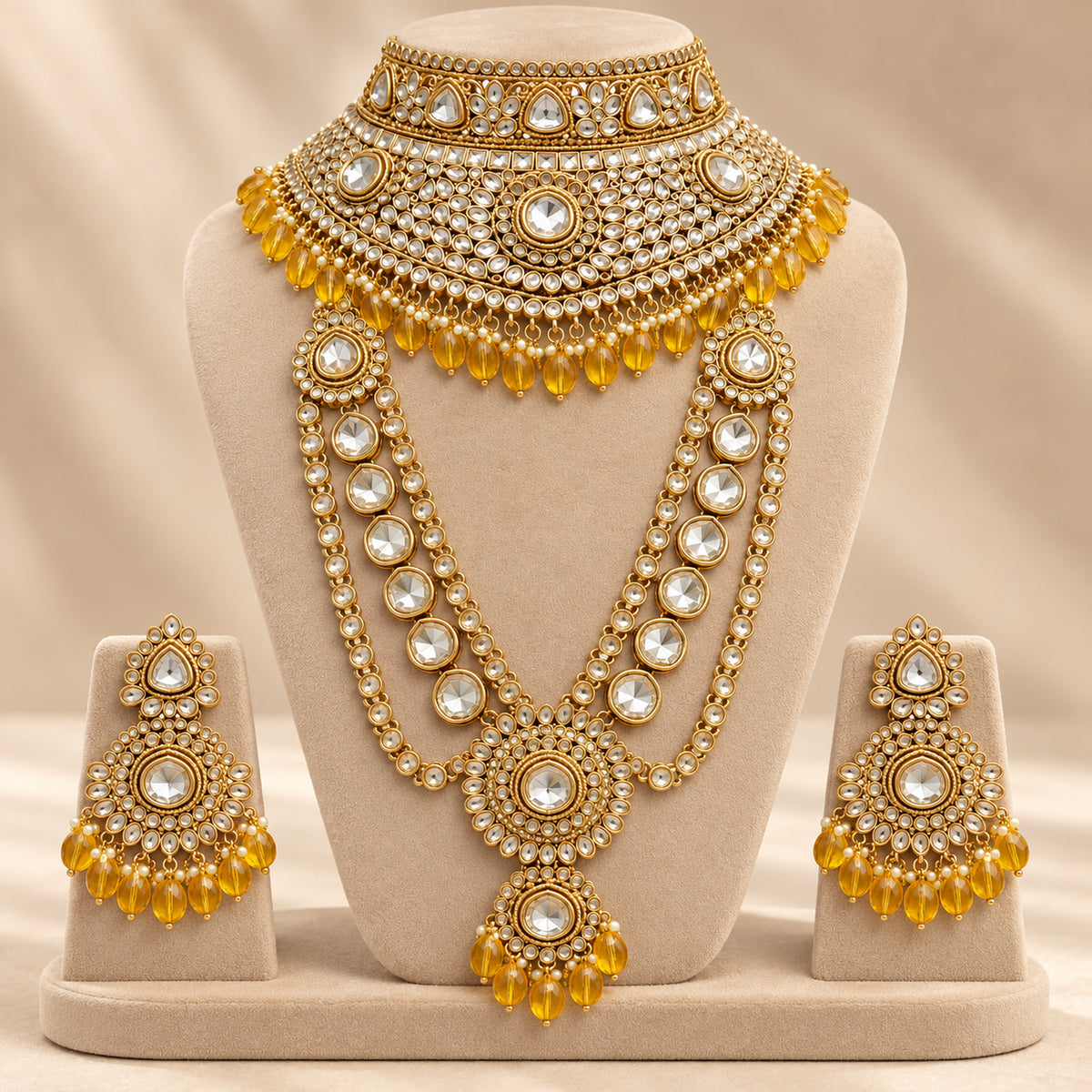 White stone choker and haar displayed with amber-yellow drop earrings